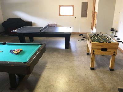 Game room with pool table, ping pong table and foosball