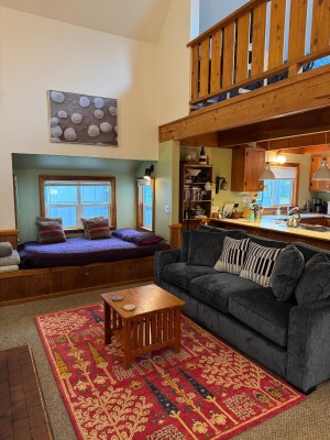 Living Room with Queen window alcove for additional sleeping area.