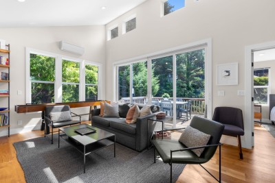 Living room with large deck behind it.