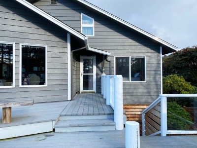 Back door - leads to river/ocean view wrap around deck and fenced side yard.