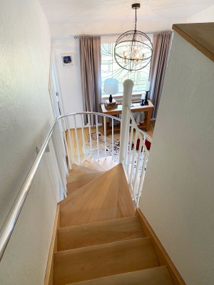 Spiral staircase from the upstairs bedroom suite.