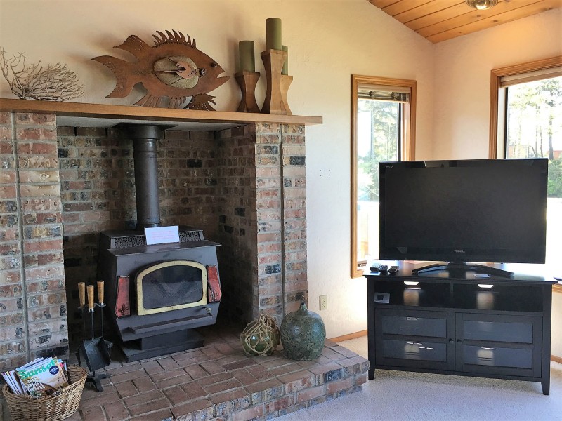 Family room with wood stove and TV/Satellite/Roku/DVD